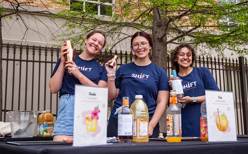 girls mixing drinks at outdoor event